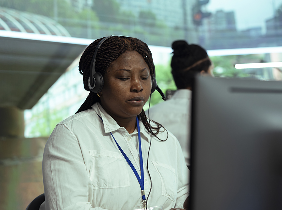 female dispatcher in front of a screen