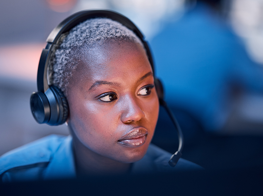 A female dispatcher with a headset on